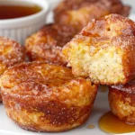 Cinnamon sugar French toast muffins with golden tops and a soft custardy center.