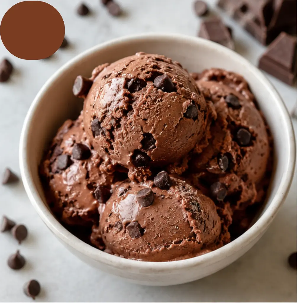 Chocolate Cottage Cheese Ice Cream in a bowl topped with mini chocolate chips, a creamy high-protein frozen dessert with rich chocolate flavor.