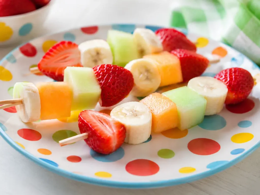 Mini fruit kabobs for kids made with soft fruit on short skewers